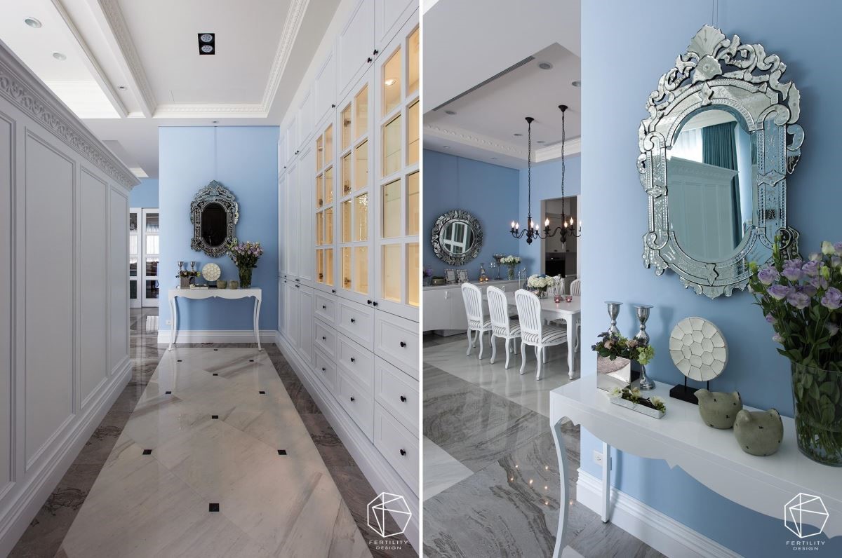 玄关廊道与客厅共享同一道半高墙，循着入口动线，即可见廊道尽头的细腻的端景。