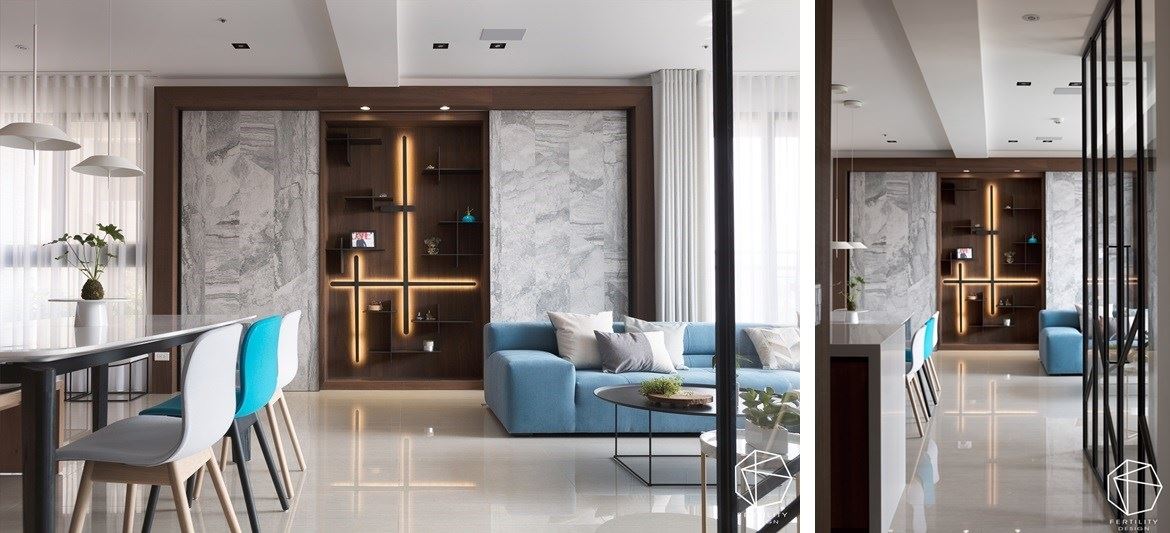 有别于其他制式空间，将视觉重心放在沙发背墙上的展示柜，顺着原进筑物结构 将储藏室跟展示柜加以结合，形成一幅走道看过来的端景画面，藉由木皮与铁件搭接书架，结合灯光及展示品妆点 变成独一无二的空间焦点。