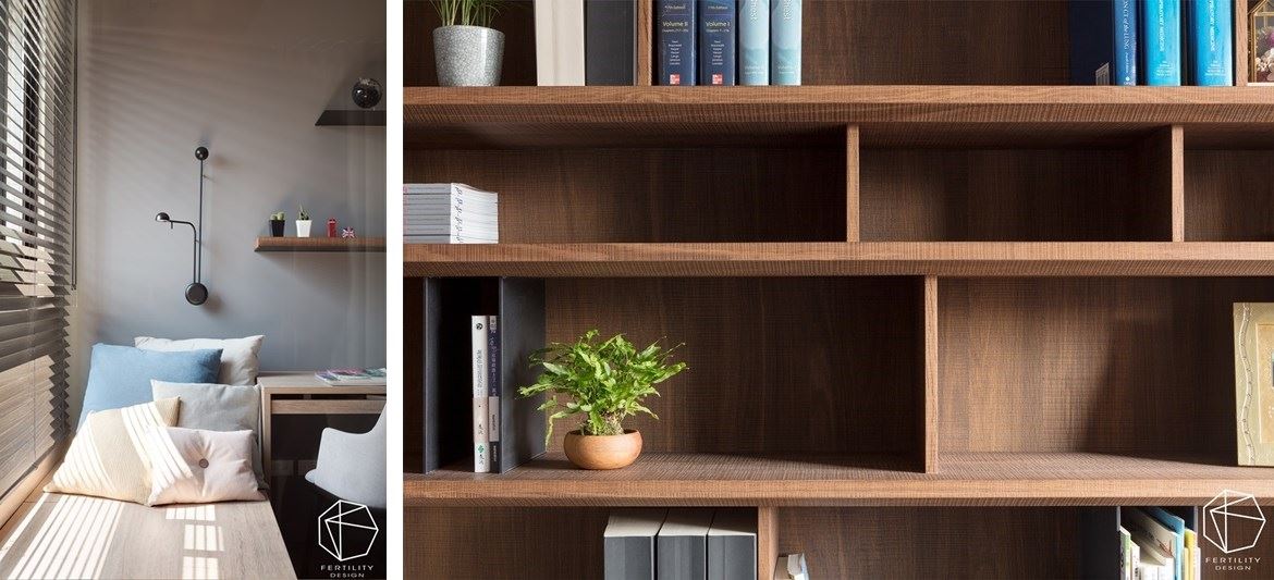 书房内的飘窗是阅读的绝佳位置，并在墙面镶嵌一座黑色几何壁灯，搭配绿意窗景，创造静谧不被打扰的氛围。